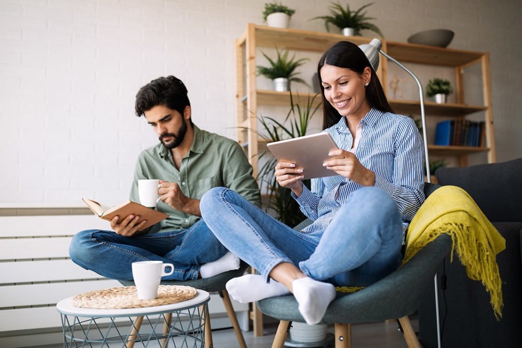 man and woman reading